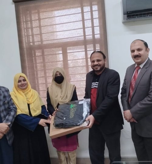 Receiving a laptop from the HOD, the Focal Person, and from beloved teachers